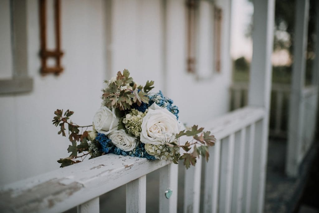bridal bouquet on a rustic wood banister