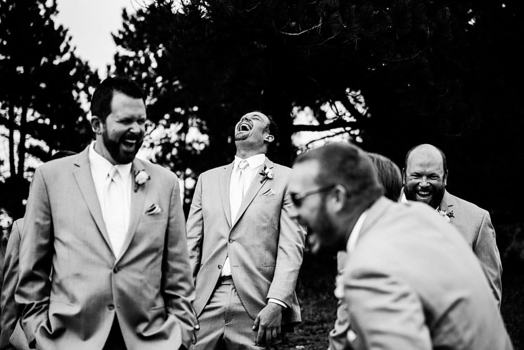 groomsmen laughing with head back