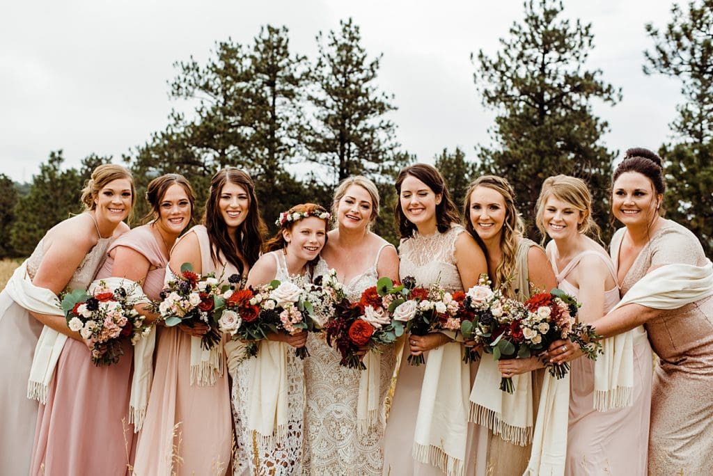 mismatched pink bridesmaids with bride