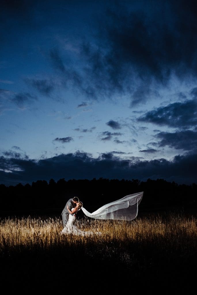 bride and groom with a dramatic veil using OCF