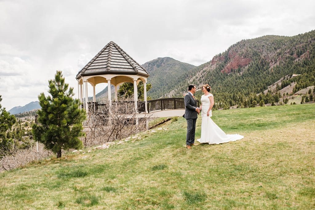bride and groom with a gazebo