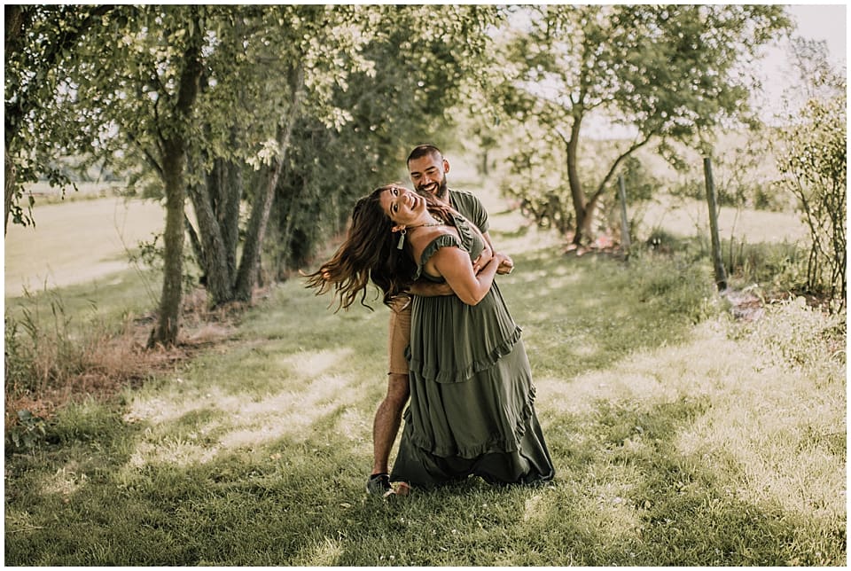 couple dancing in a grove of trees