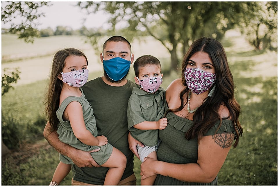family of four wearing masks for family photos