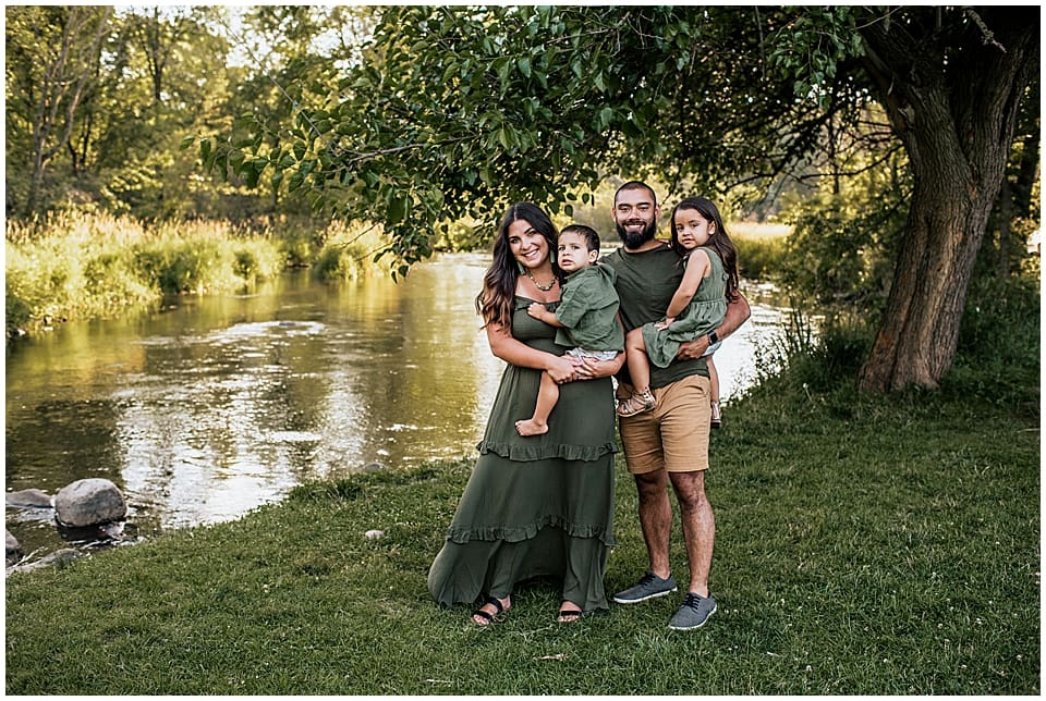 family of four by the river