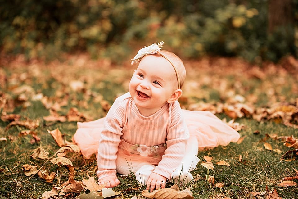 6 month old baby girl in the fall in wisconsin