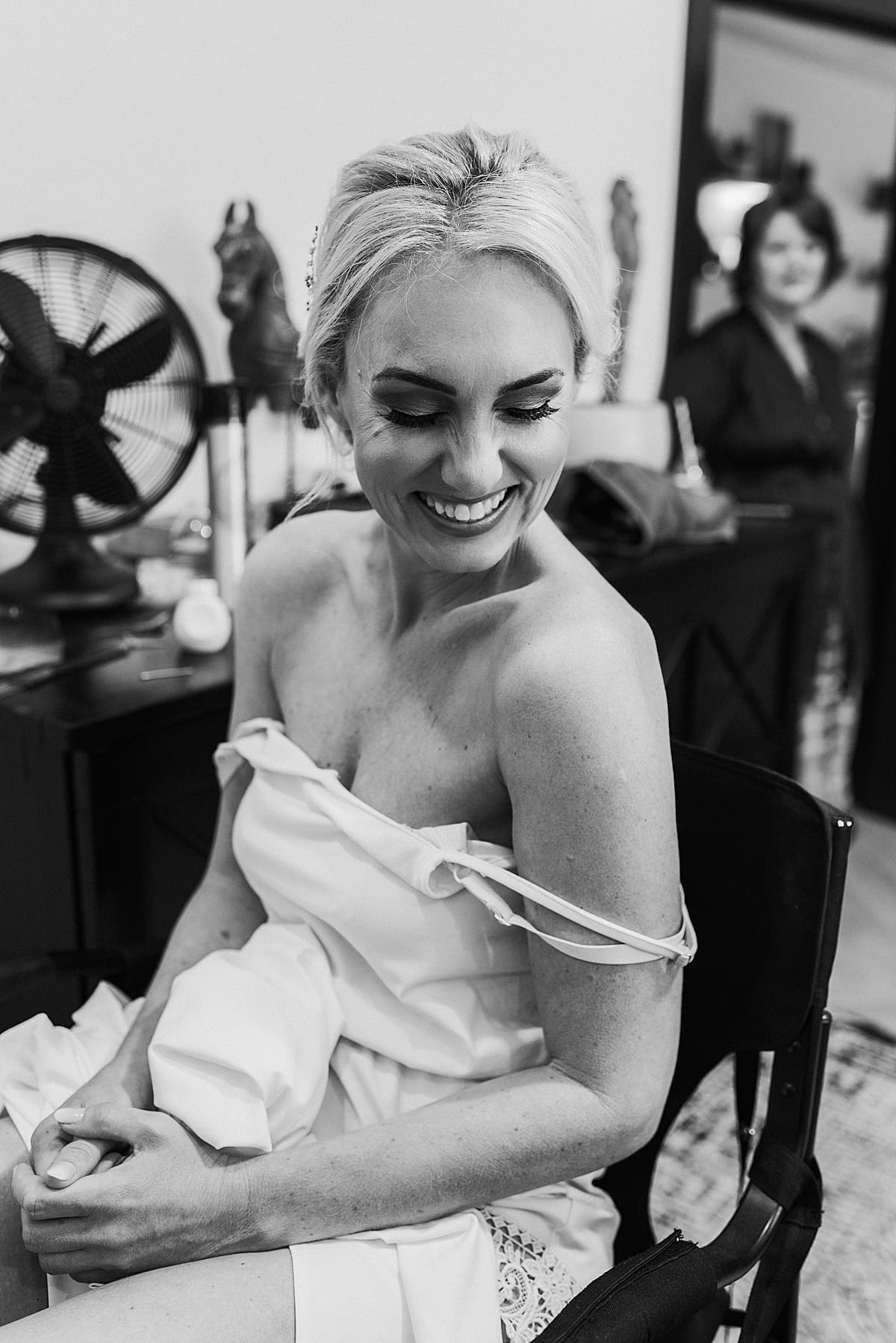 happy bride in the makeup chair