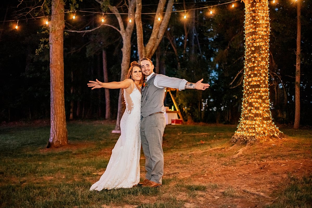 wedding couple under string lights