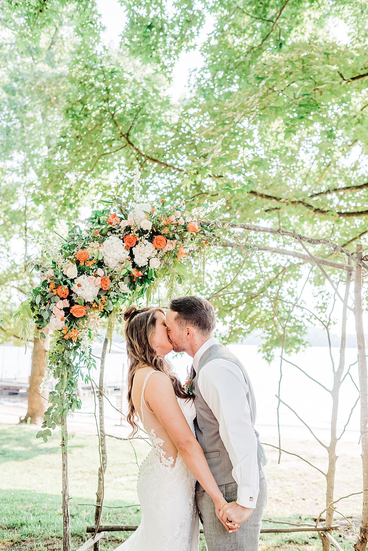 first kiss under a bohemian inspired altar