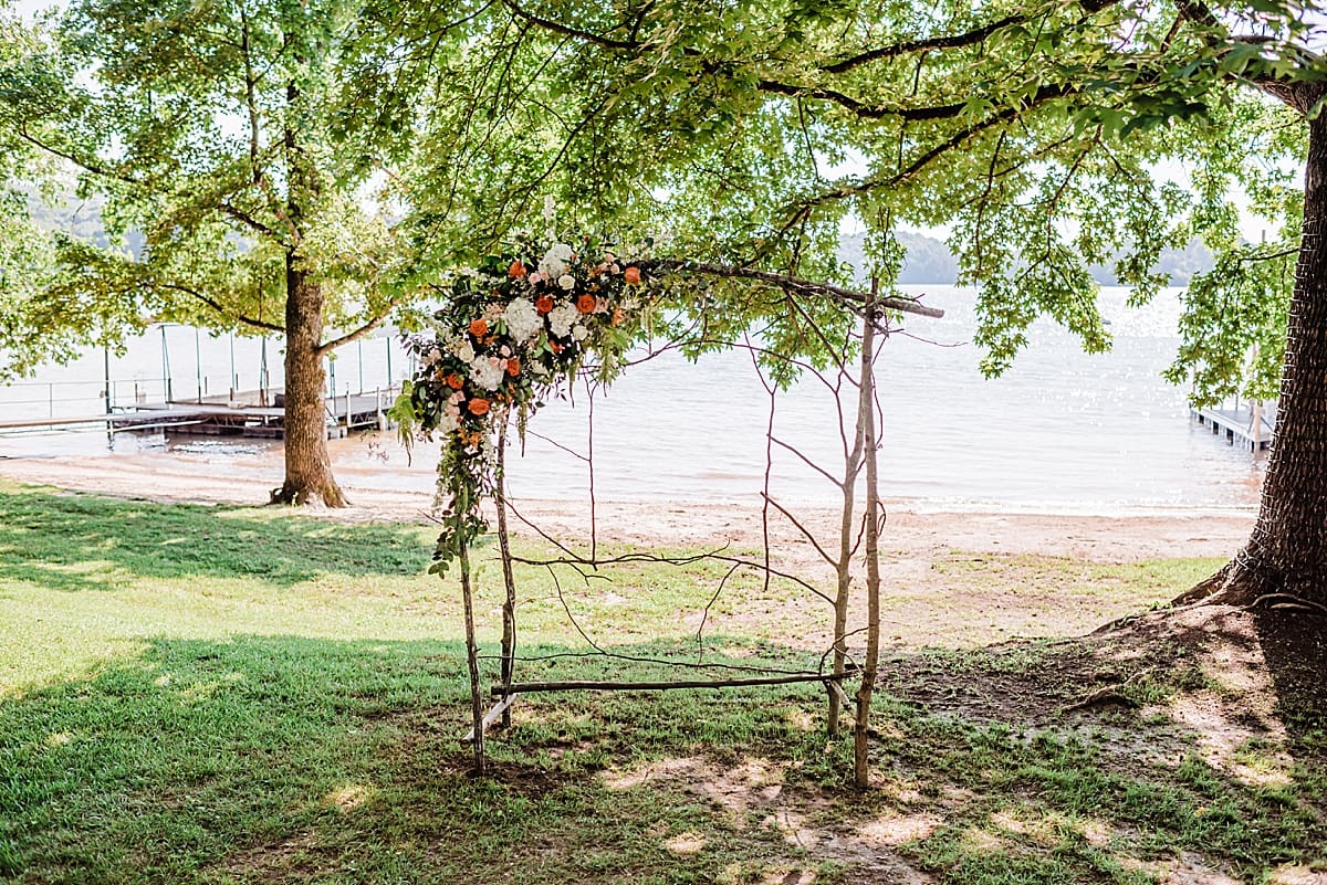 bohemian style wedding arch with summer color flowers
