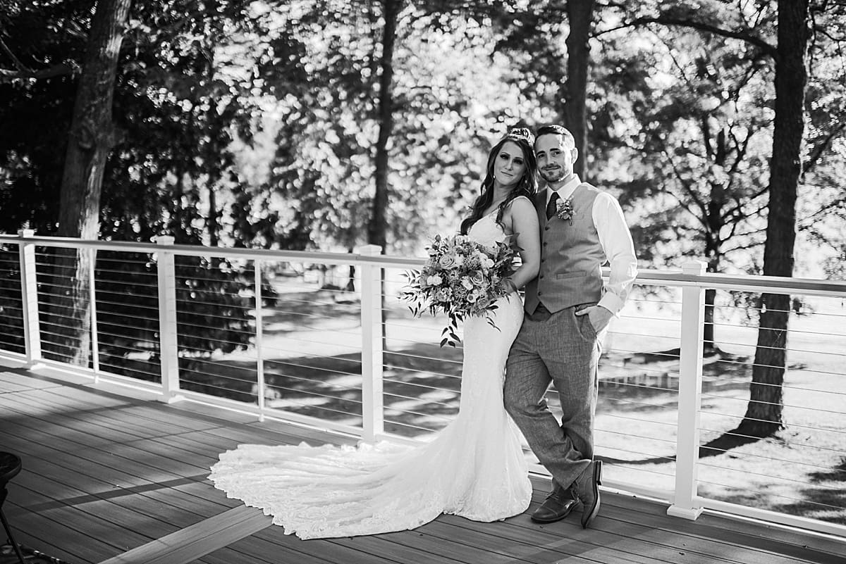black and white lakeside wedding couple