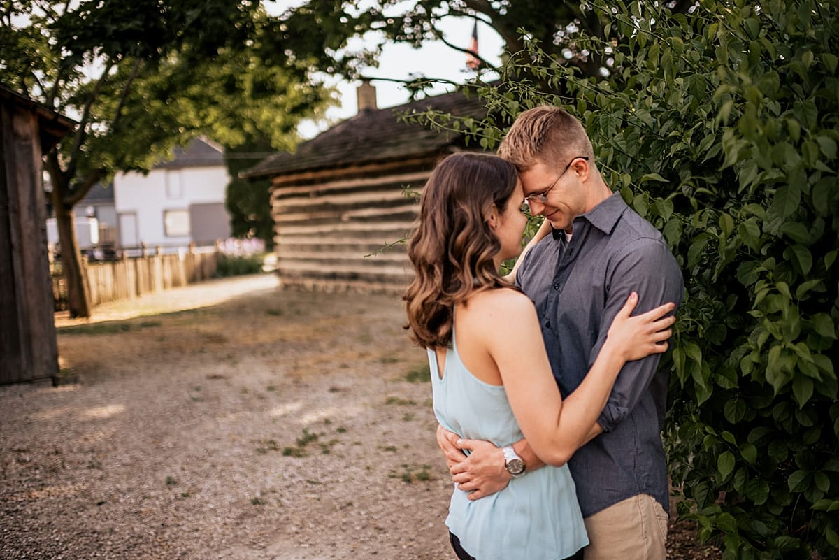 engagement session next to historic log cabin