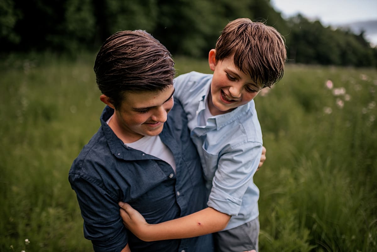 brothers playing together during elkhorn family session