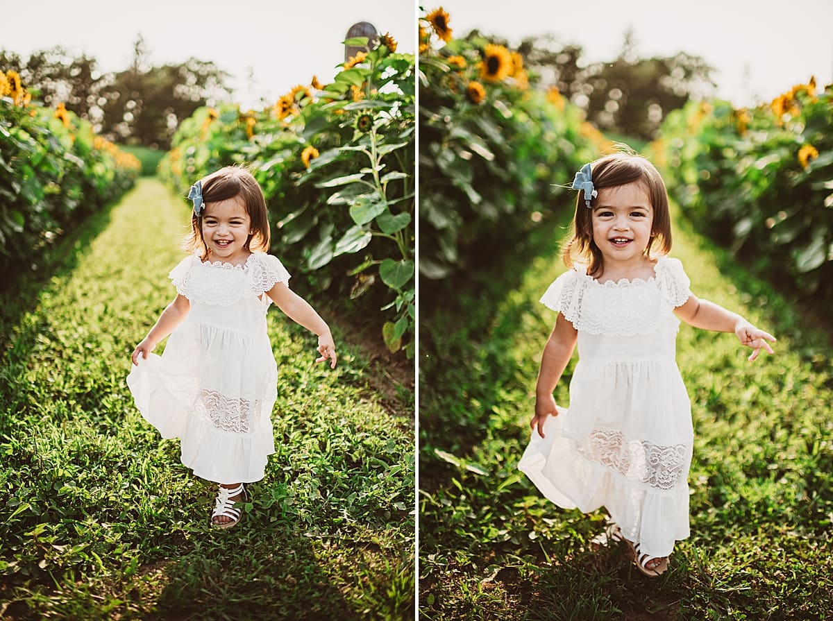 toddler running through a sunflower field