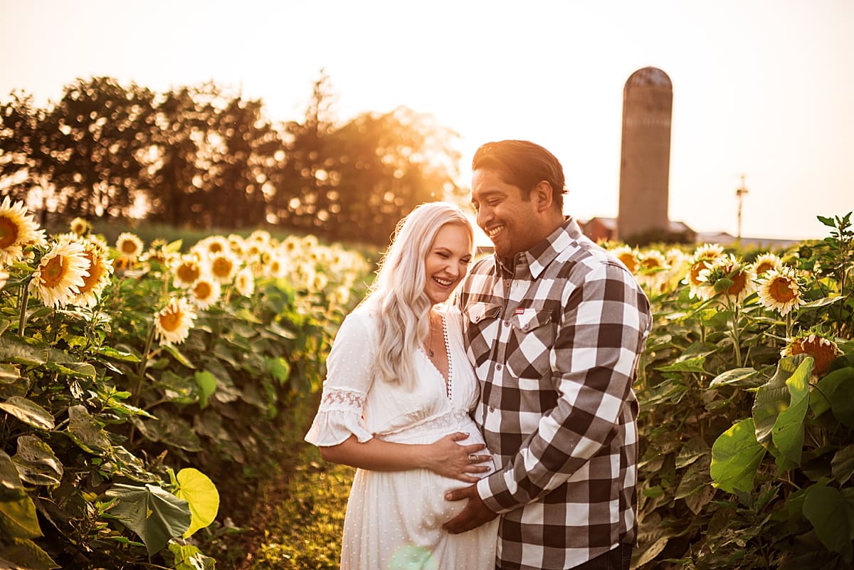 happy couple during summer maternity photo session