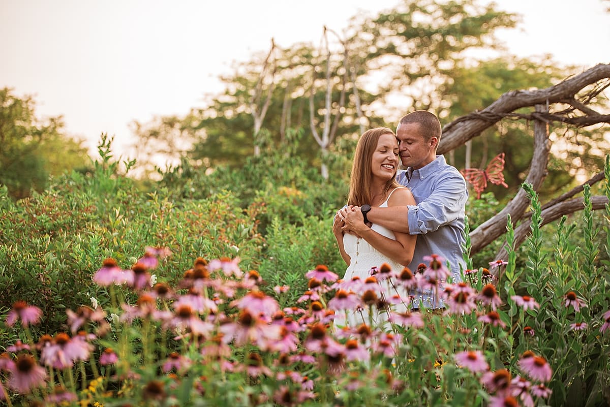 engagement session in a field of flowers