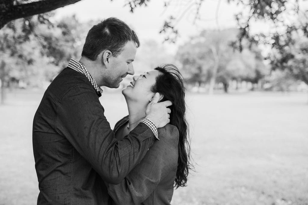 rainy day engagement session under trees