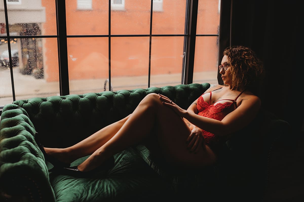 boudoir on a sofa in front of a window