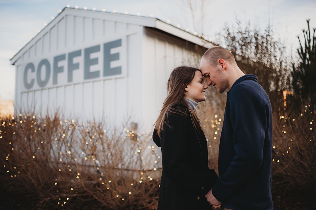 couple kissing at boxed and burlap engagement session