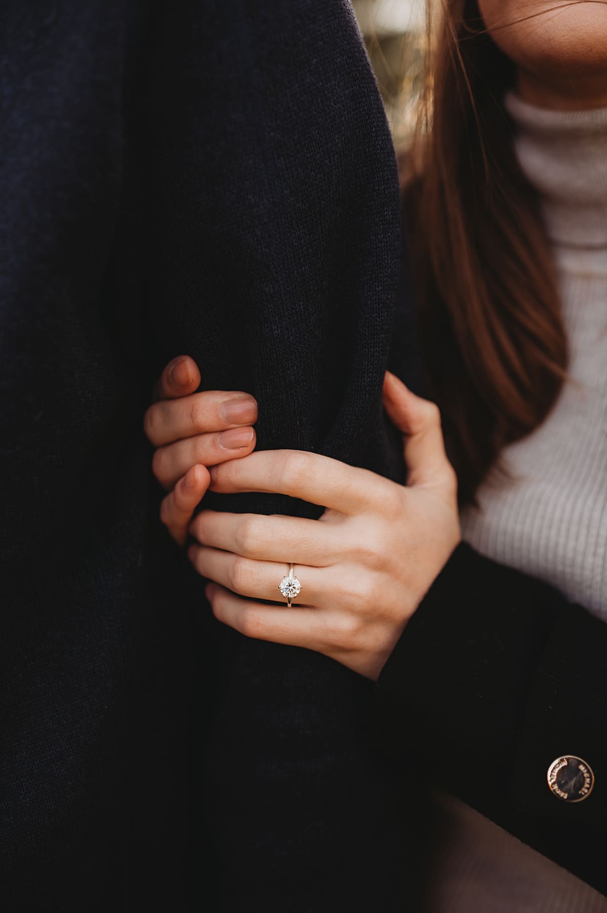 close up of engagement ring during engagement session