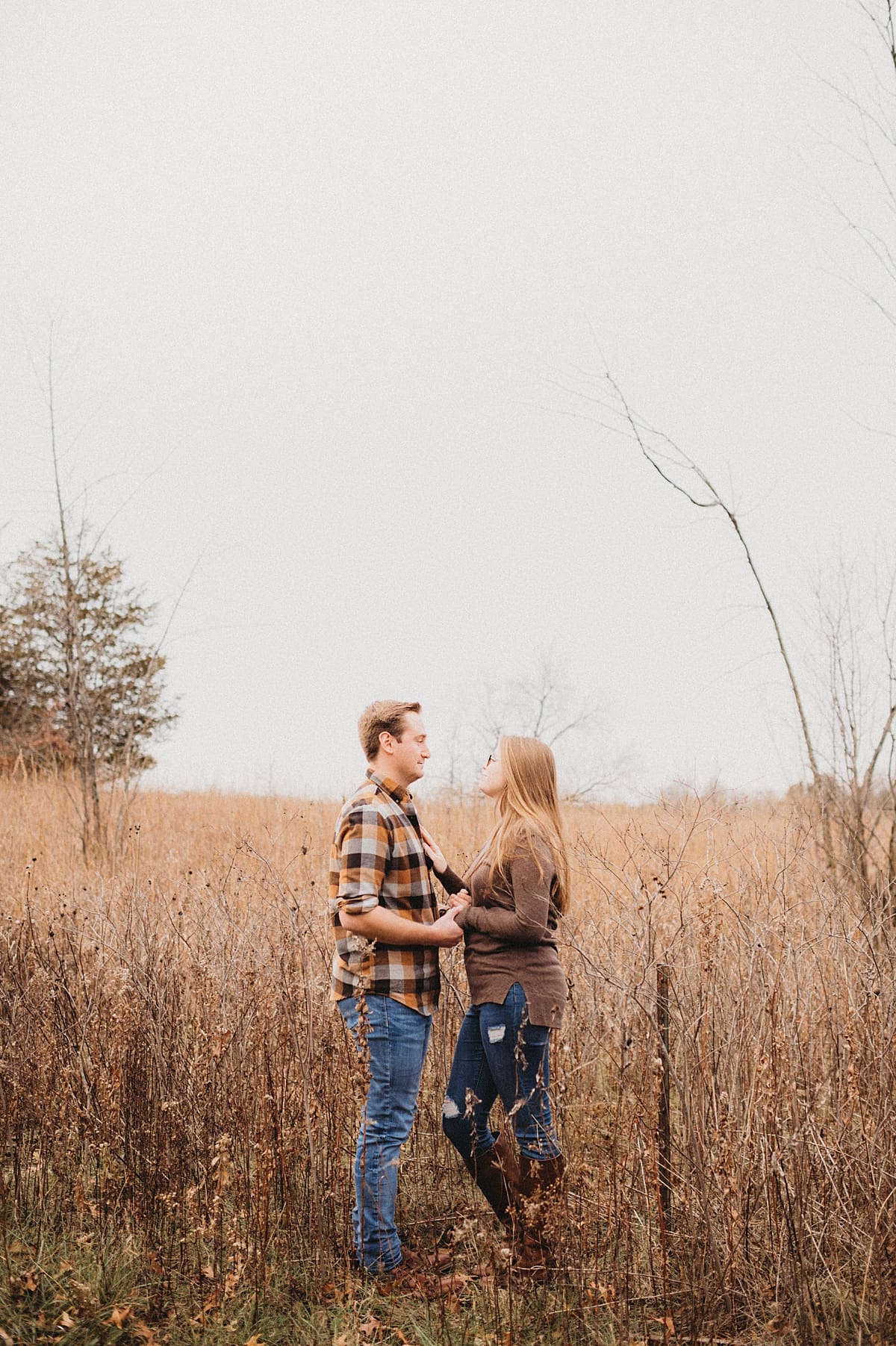 couple standing together in a field