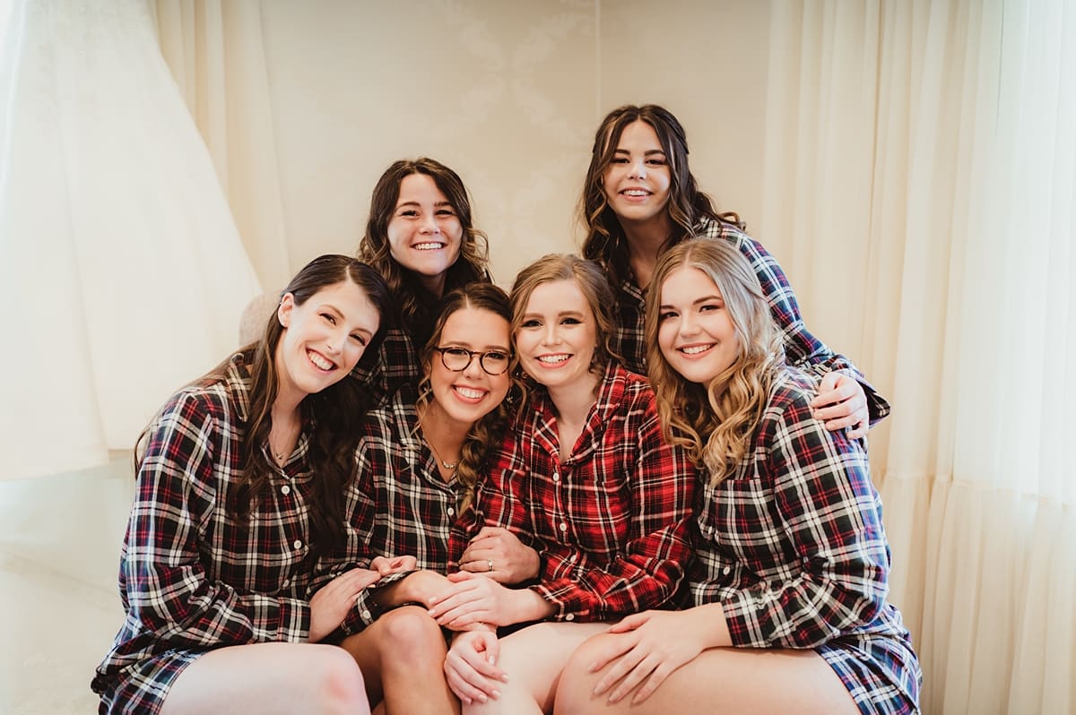 bridesmaids and bride with matching plaid pajamas