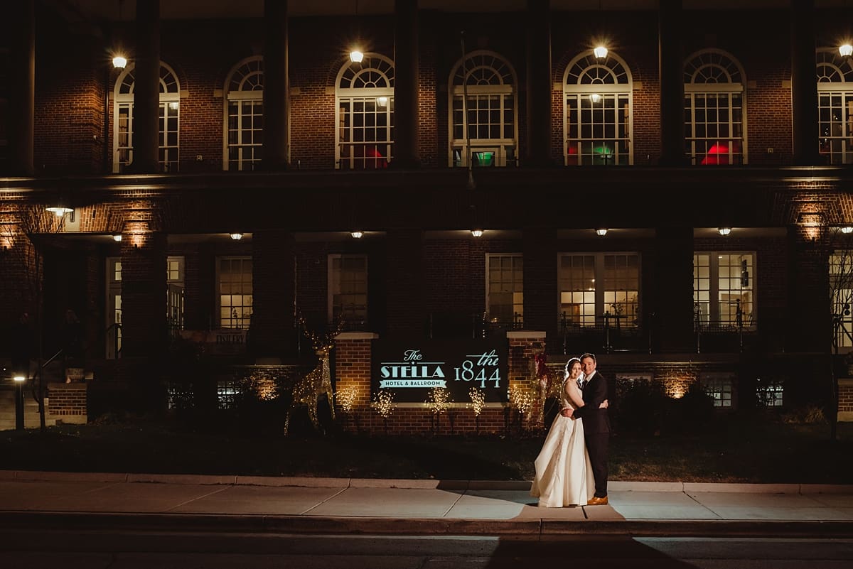 nighttime wedding photos in front of the stella hotel and ballroom