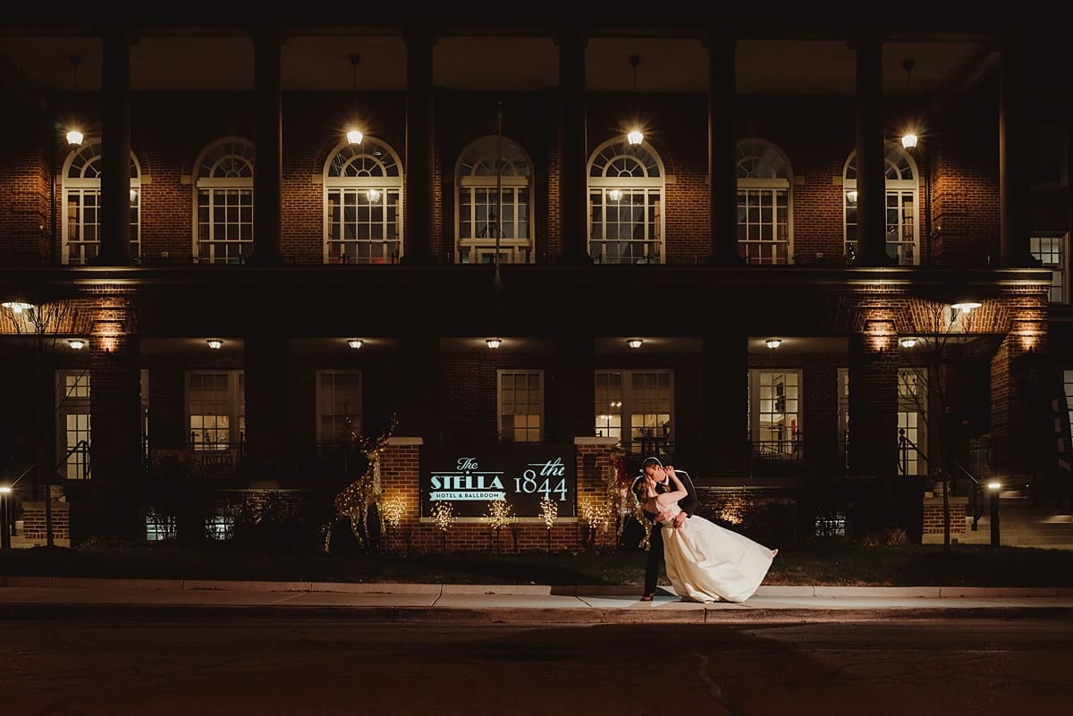 nighttime wedding photos in front of the stella hotel and ballroom