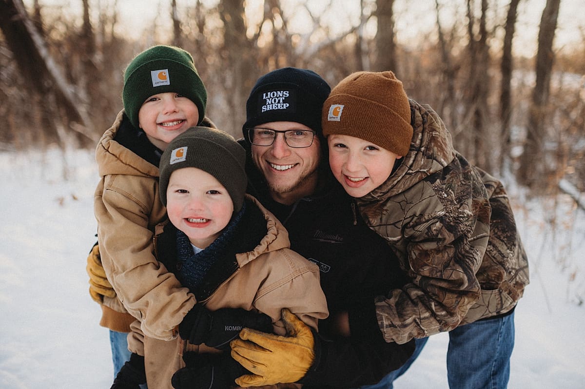 dad hugs with boys during photos