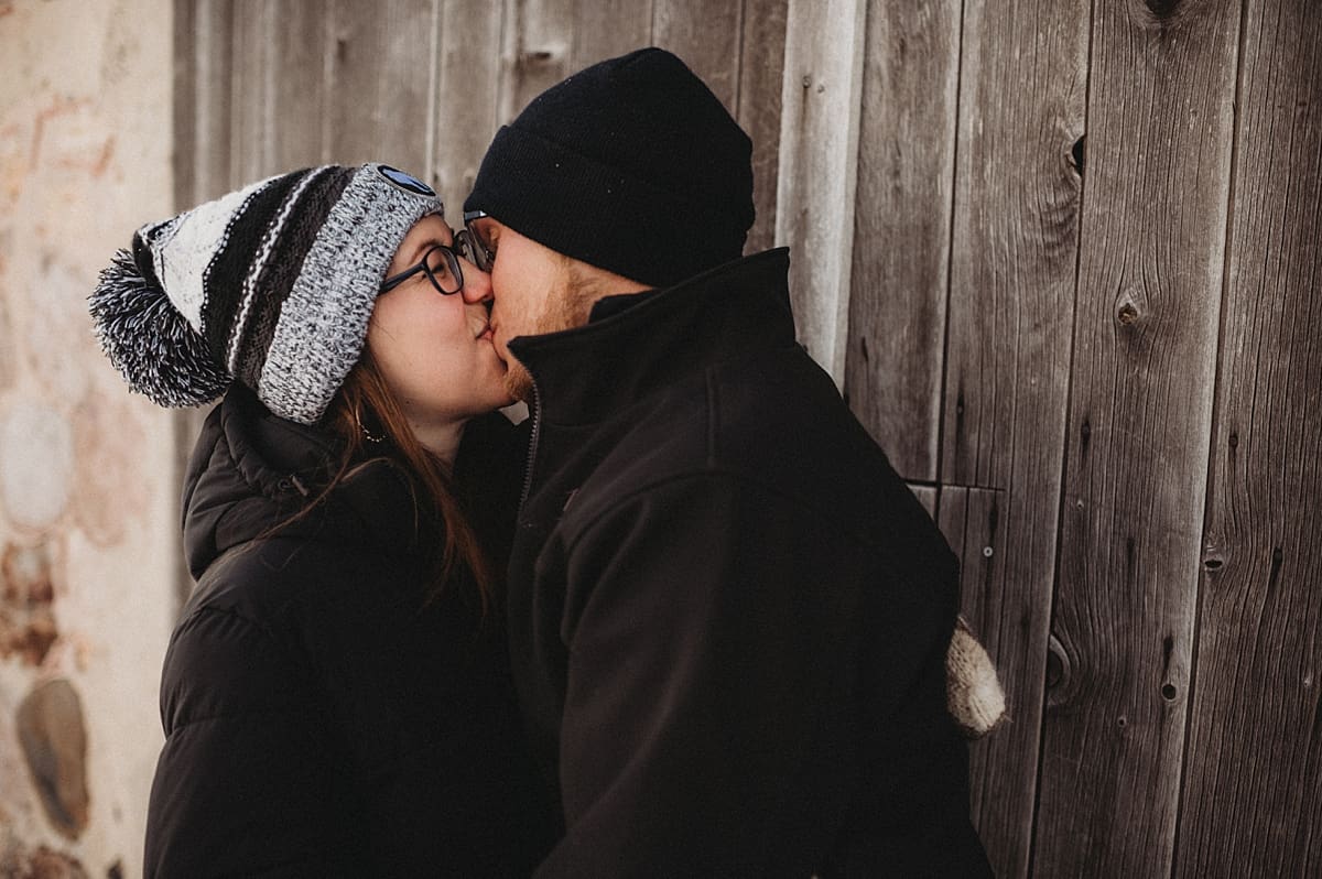 Husband and Wife Kissing at Barn