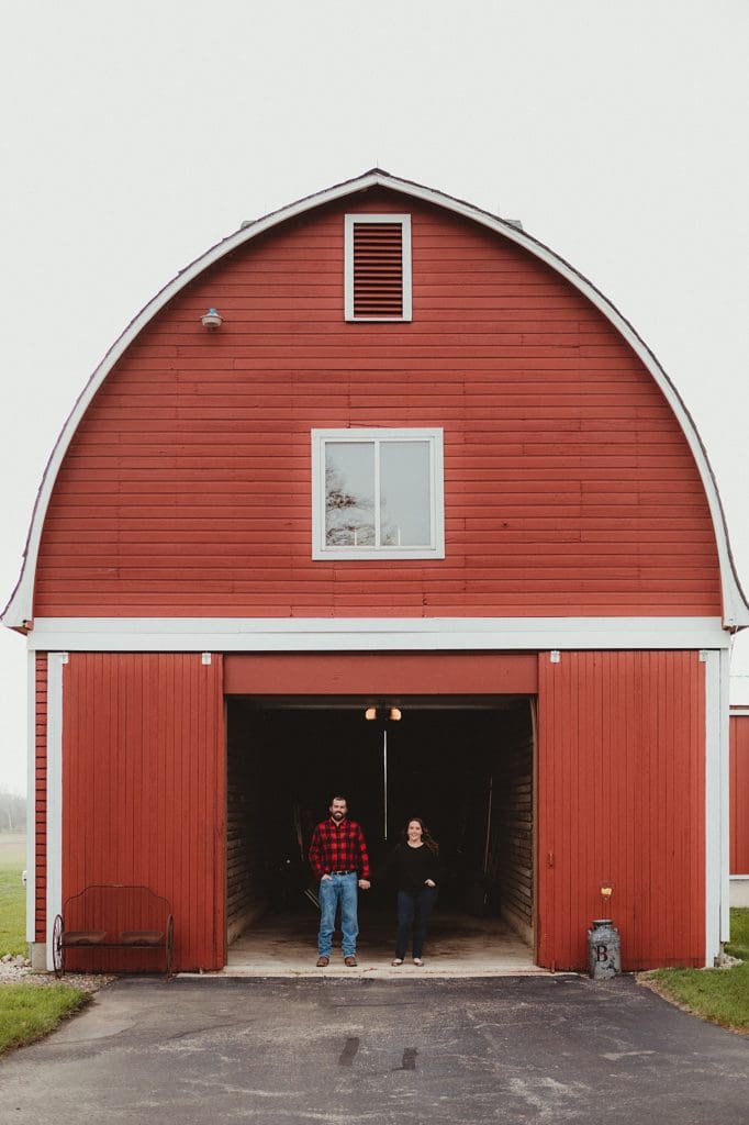 engagement photos with old red barn and silos