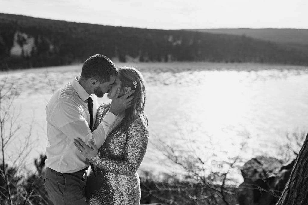 black and white photo of couple kissing