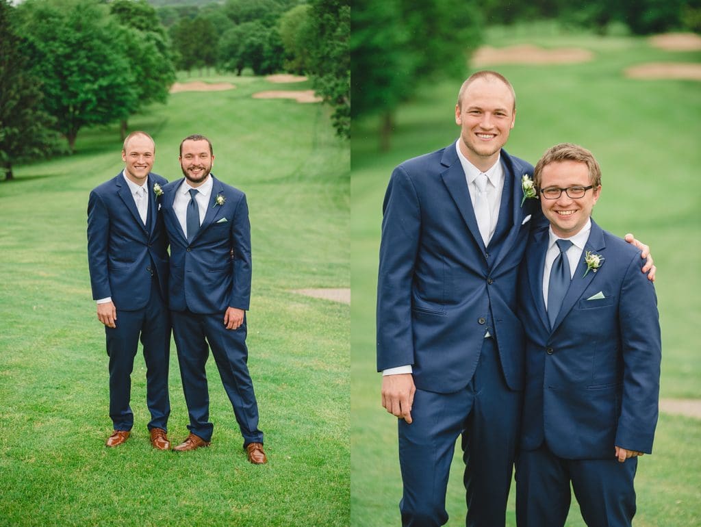 large grooms party wearing navy blue suits from mens wearhouse