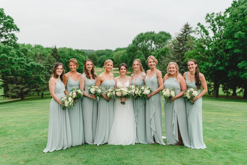 large bridal party wearing mint green dresses from davids bridal