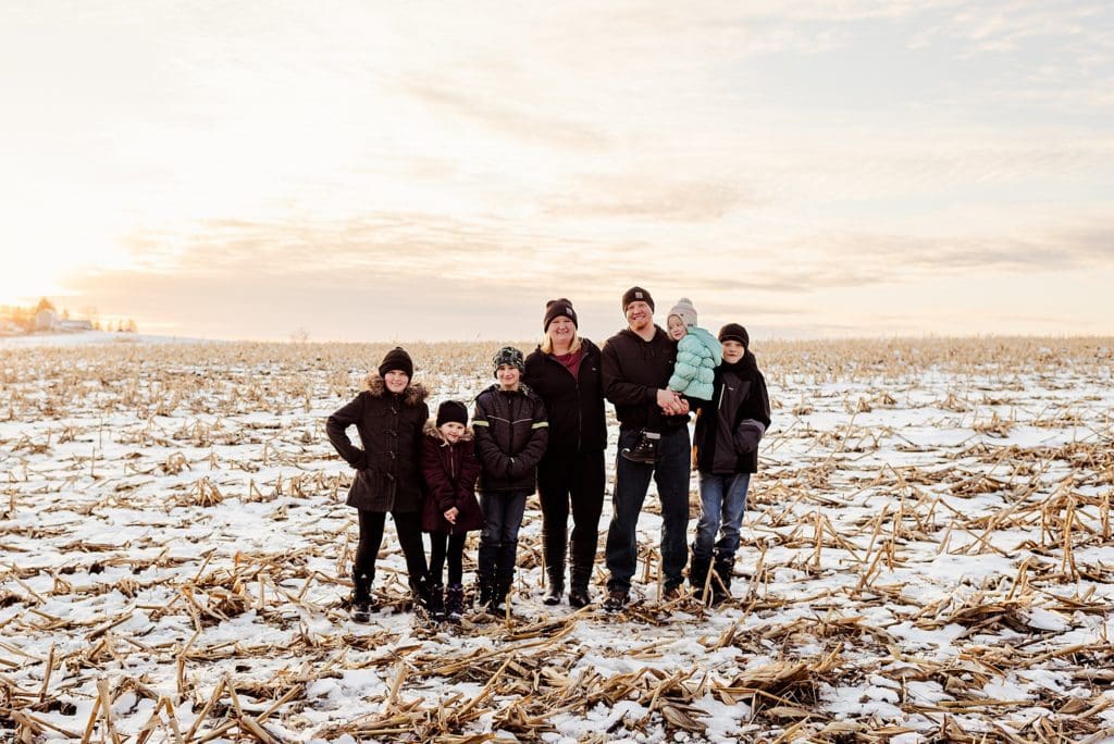 family session in wintery corn field in wisconsin