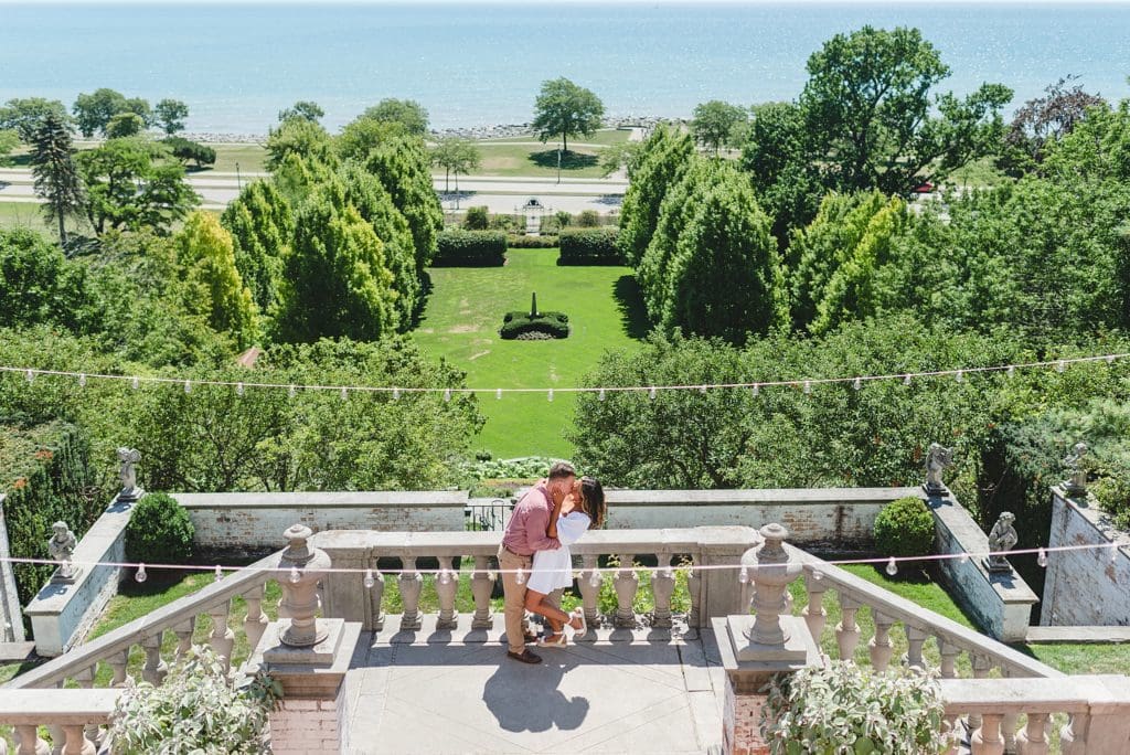 engagement session on a balcony overlooking lake michigan