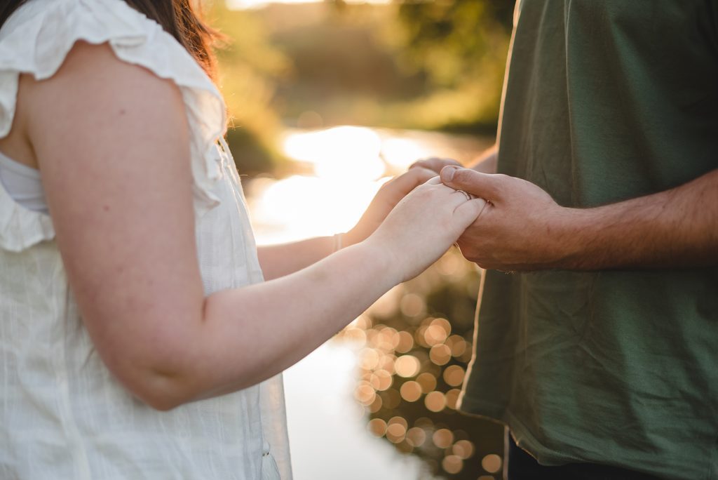 couple holding hands for engagement photgorapher