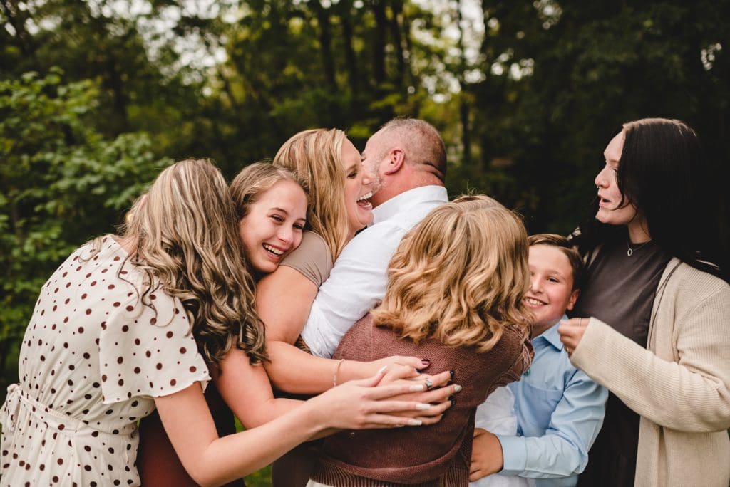 blended family celebrating surprise proposal