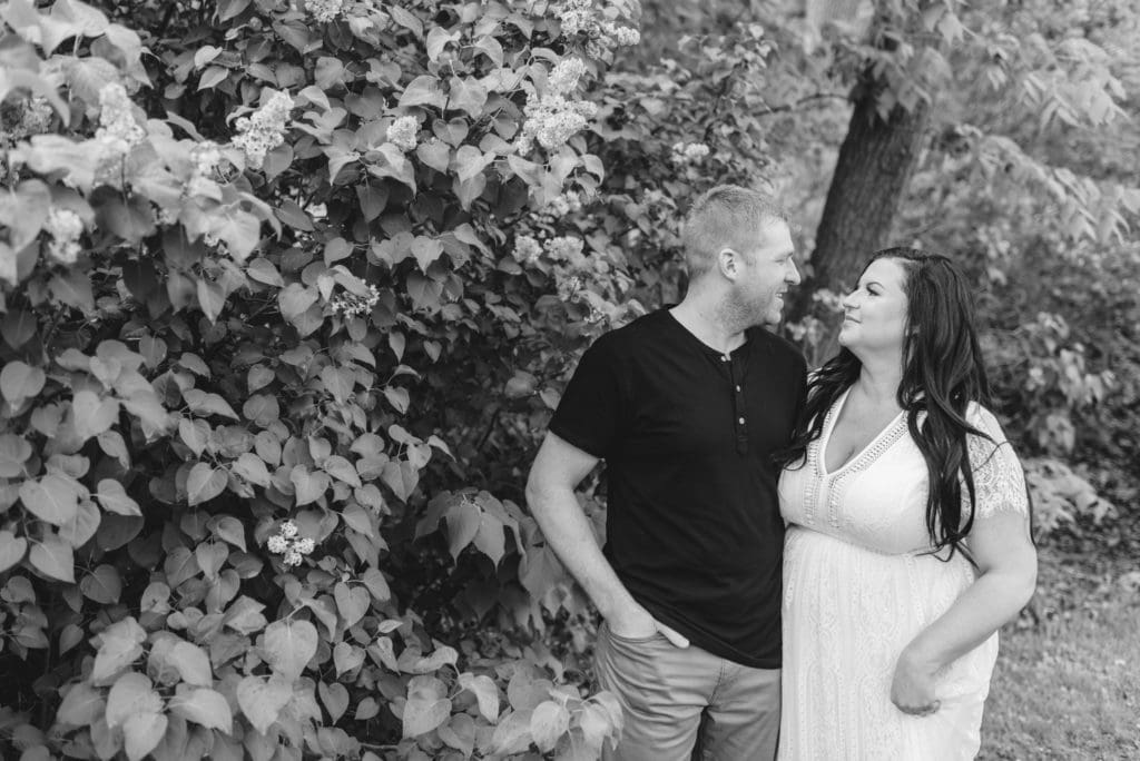 black and white photo of engaged couple looking at each other