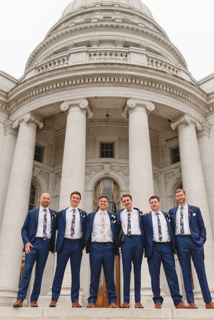 groom party photos on the steps of the wisconsin capitol building