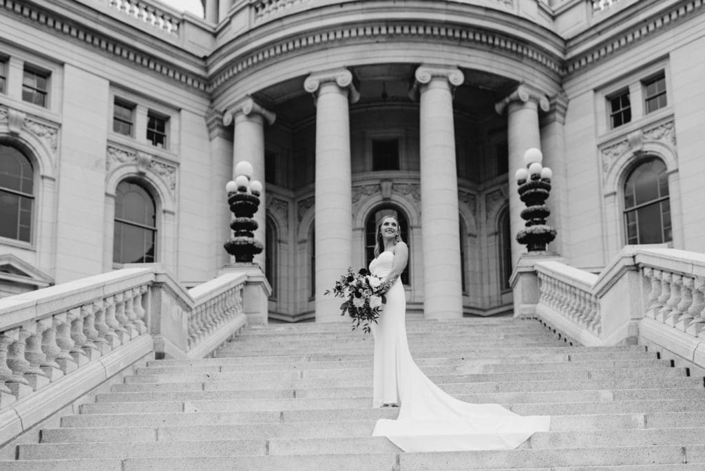 bridal photos on the steps of the wisconsin capitol building