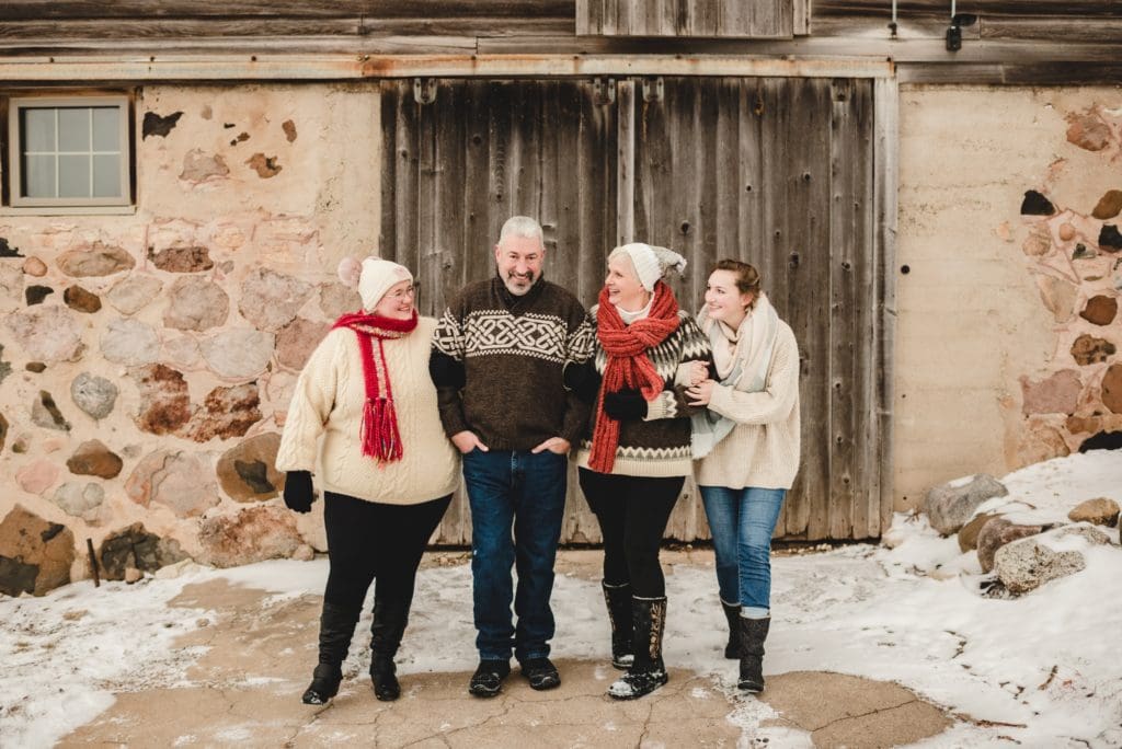 family with adult children walking together during christmasy family session