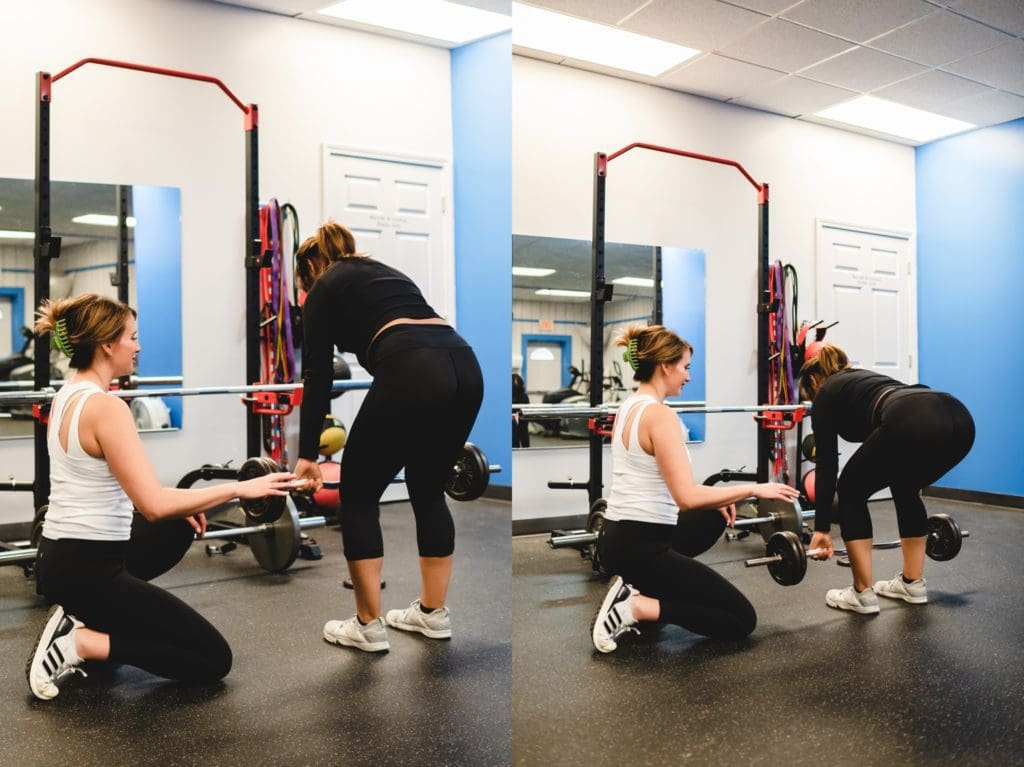 woman trainer showing woman how to do a dead lift