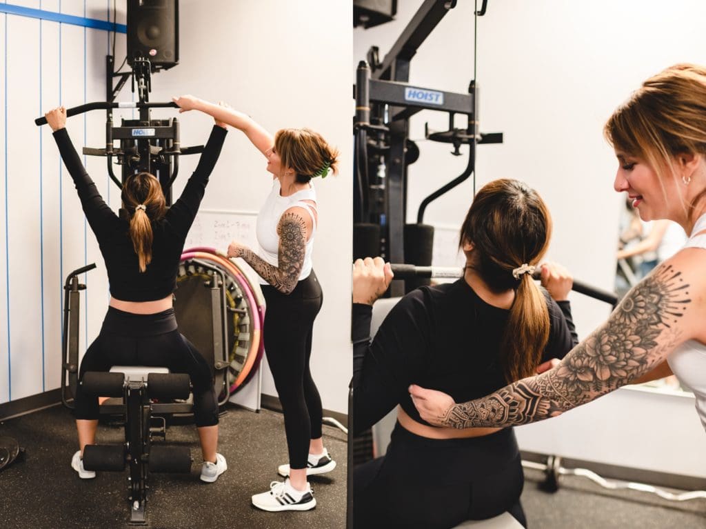 female personal trainer showing client how to use weight machine