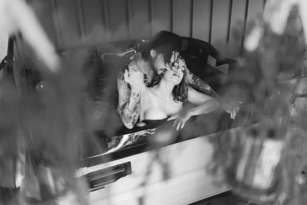 couples boudoir in an outdoor jacuzzi