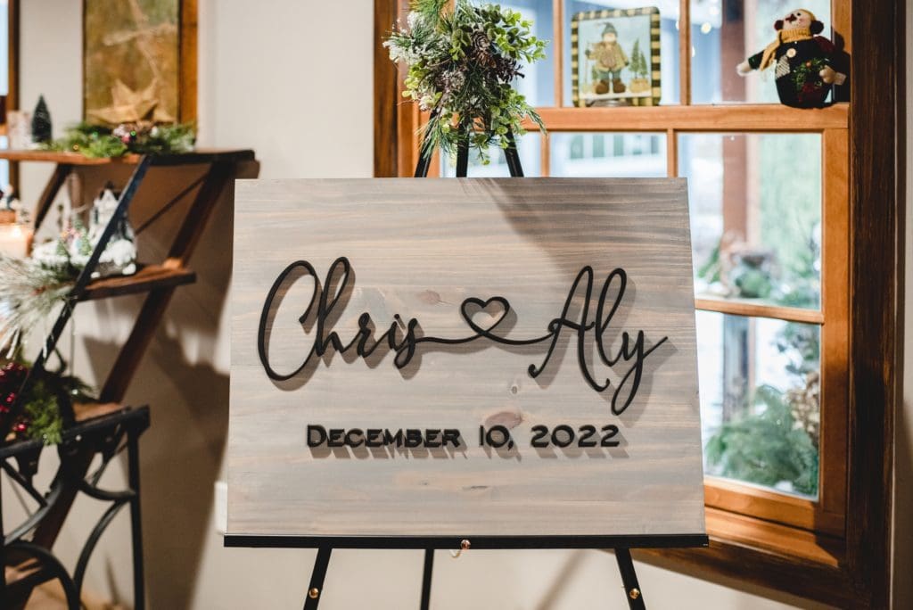 wood marriage sign with cursive font