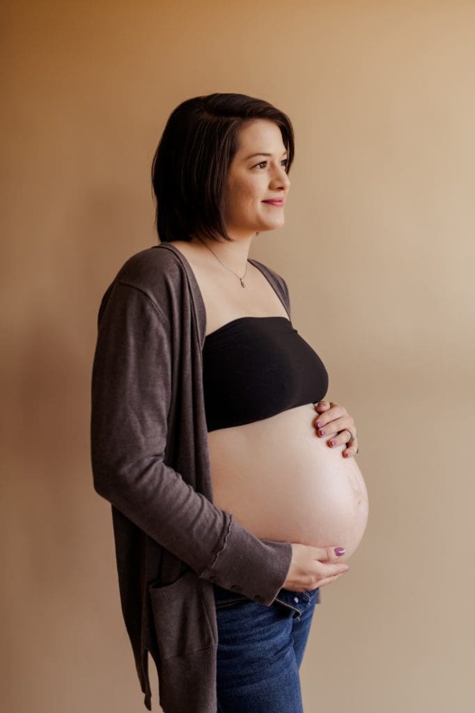 studio maternity photos with nude color backdrop