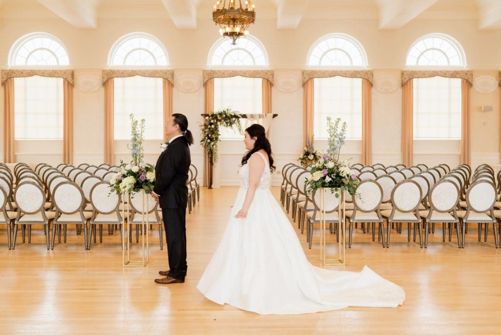 first look with father at indoor ceremony site