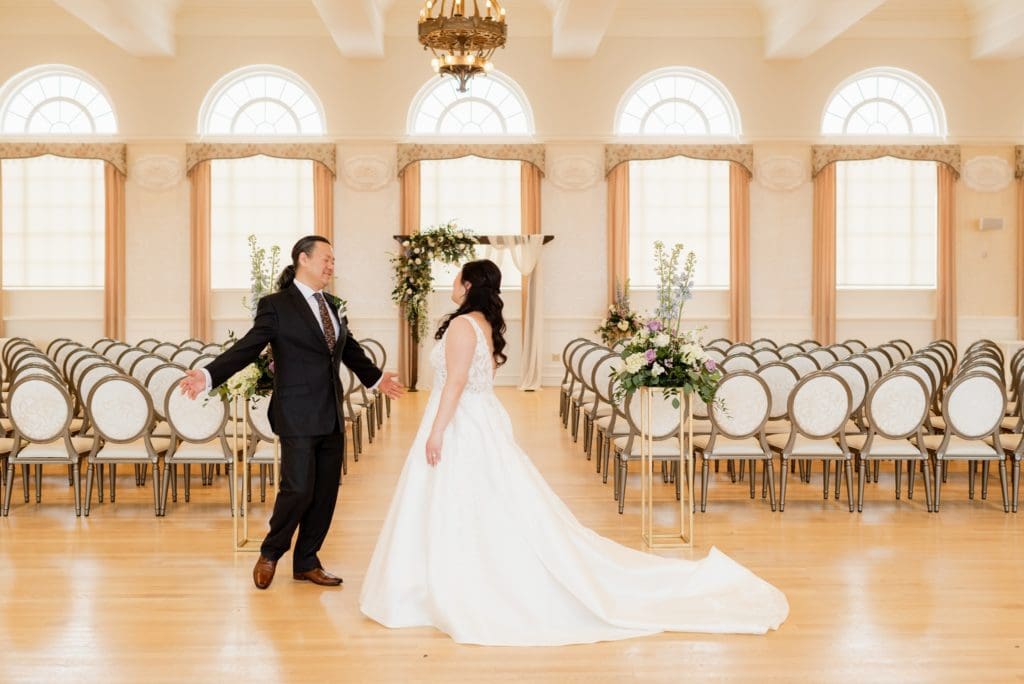 first look with father at indoor ceremony site