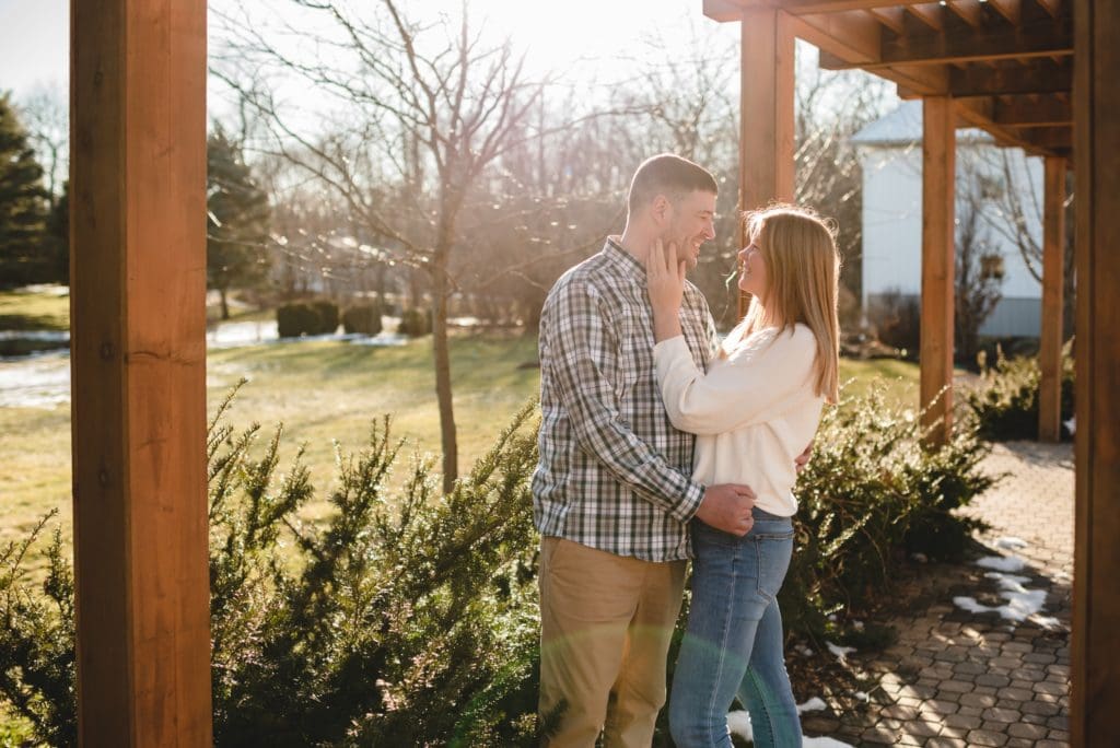 woman holding man's face engagement photo pose
