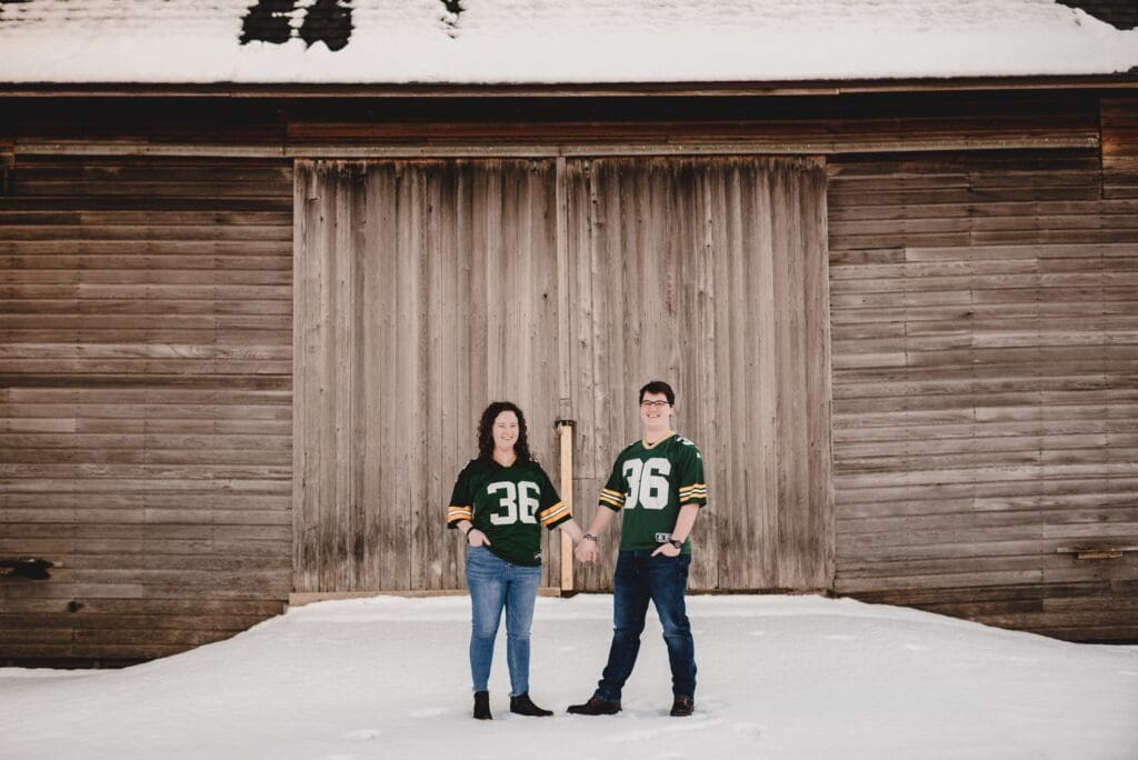 engagement photos with couple wearing matching football jerseys